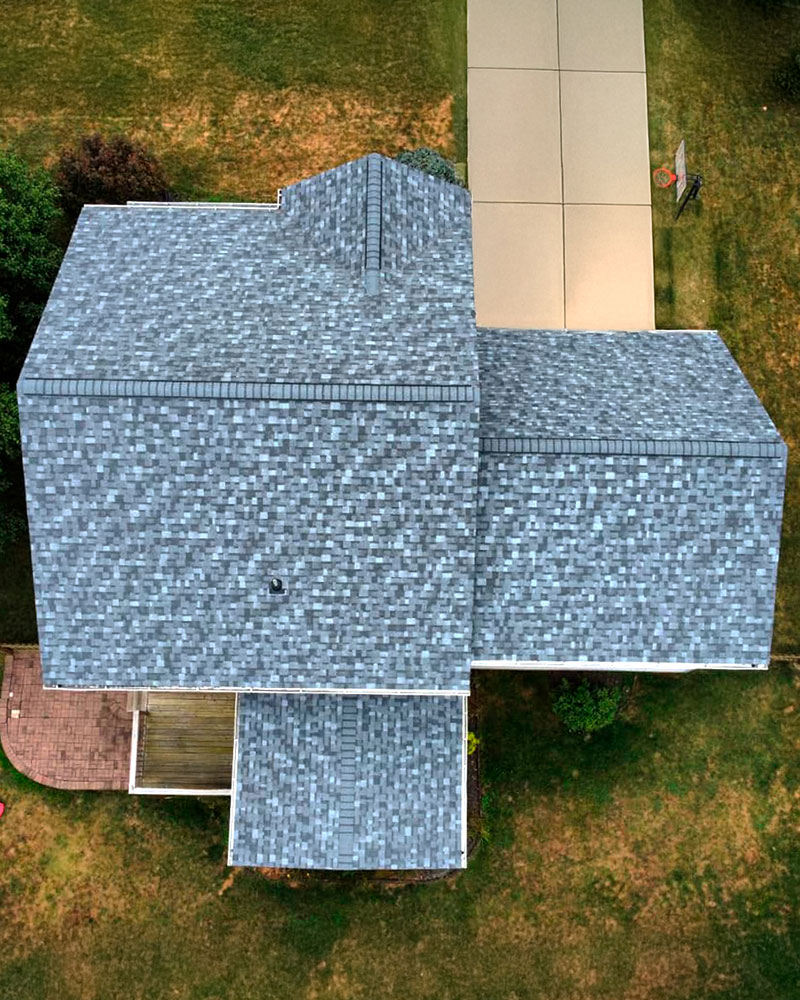Overhead of a completed architectural shingle roof and driveway