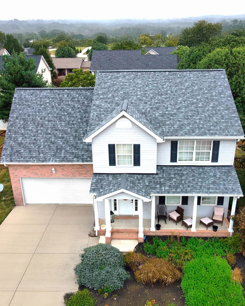 Two-story home with a new architectural asphalt-shingle roof