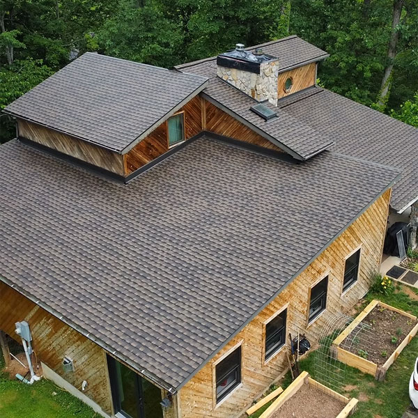 Cedar home with a brown architectural shingle roof